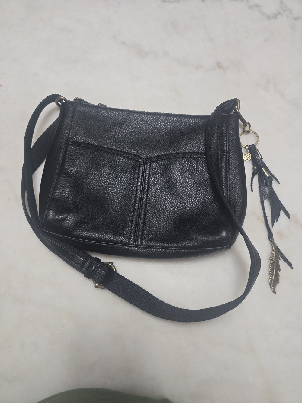 The Sak Black Pebbled Leather Crossbody with Feather Charm